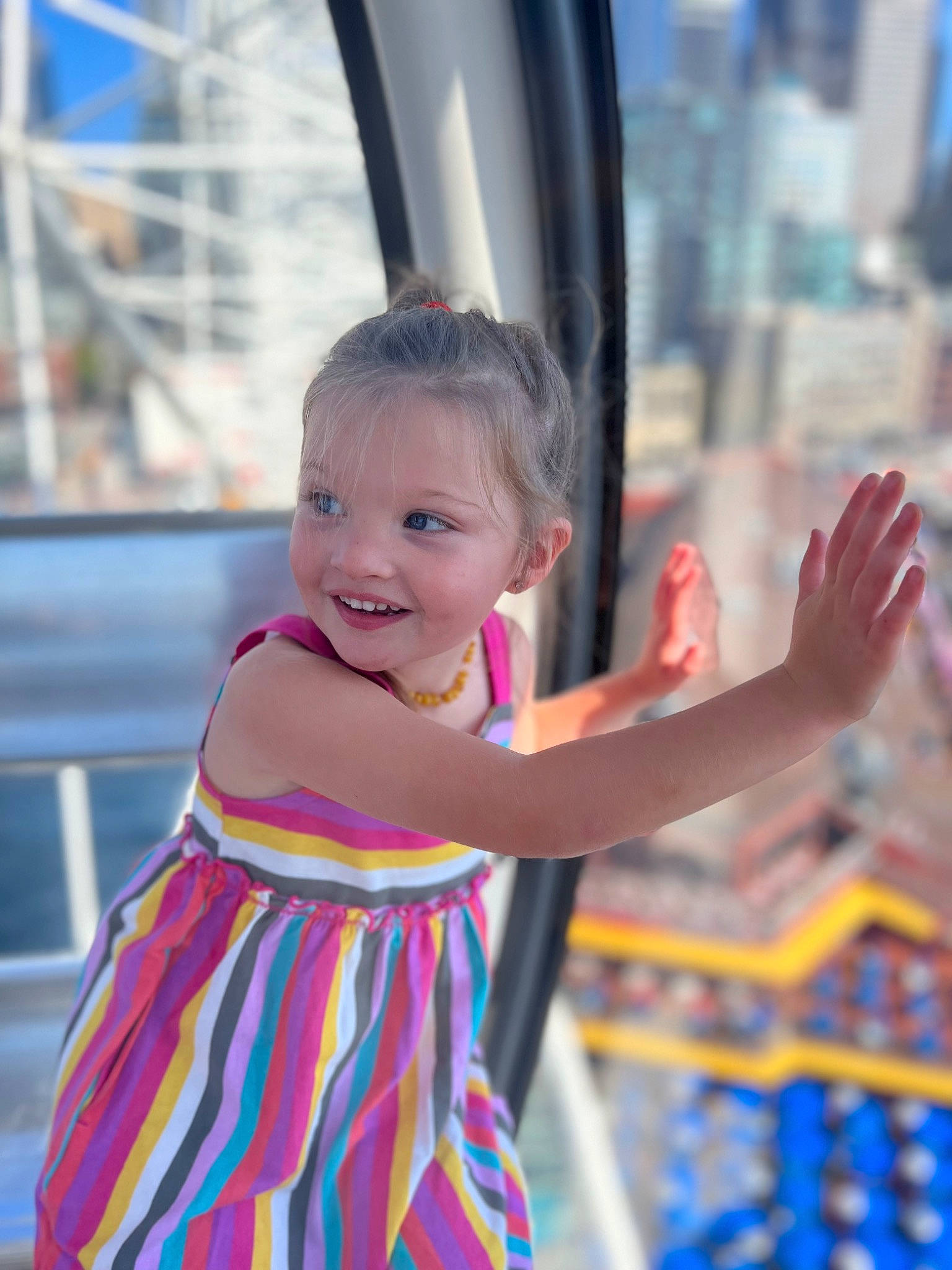 Harper is registered to the contest to win money with this photo: auto_part, child, city, entertainment, event, festival, fun, happy, joy, leisure, magenta, performing_arts, person, pink, public_event, recreation, smile, t_shirt, toddler, tradition