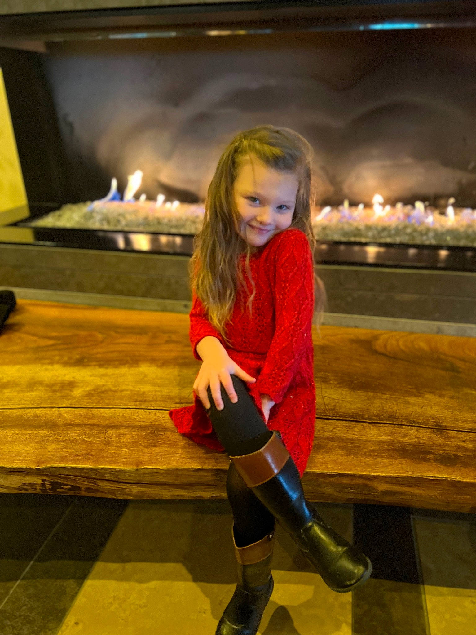 Harper is registered to the contest to win money with this photo: blond, boot, brown_hair, electric_blue, event, fashion_design, flash_photography, flooring, fun, heat, human_leg, joy, knee, leisure, long_hair, orange, person, recreation, sitting, sportswear