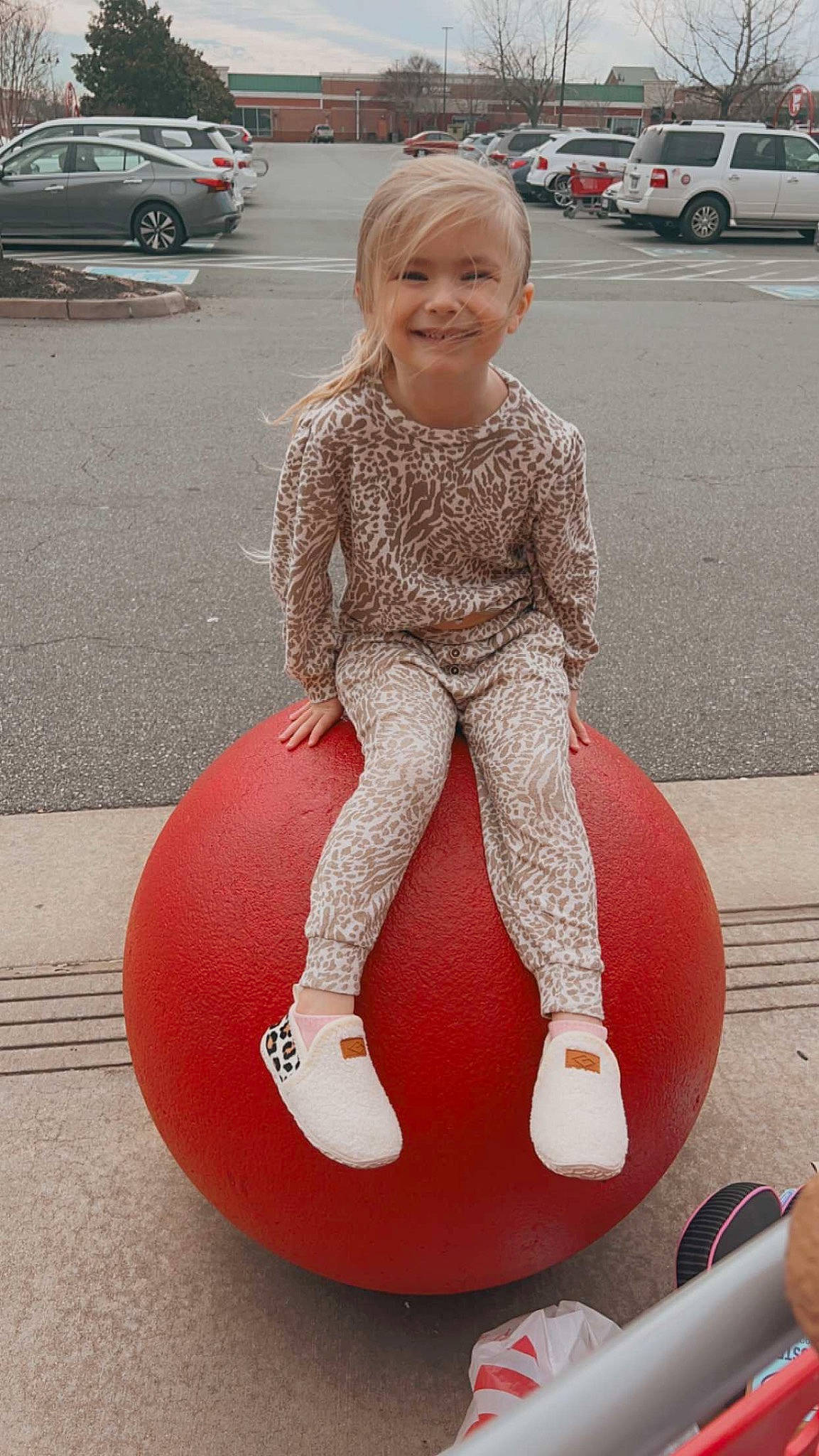 Raegan is registered to the contest to win money with this photo: arm, car, cool, dress, facial_expression, fun, hairstyle, happy, human_leg, joint, joy, leg, leisure, person, pink, recreation, road_surface, smile, thigh, vehicle