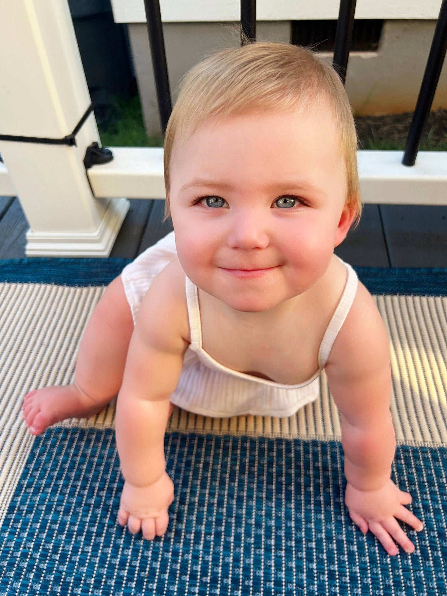 Harlyn is registered to the contest to win money with this photo: baby_toddler_clothing, cheek, chin, crawling, eye, eyebrow, face, facial_expression, floor, flooring, head, iris, joint, joy, leg, mouth, nose, person, skin, smile