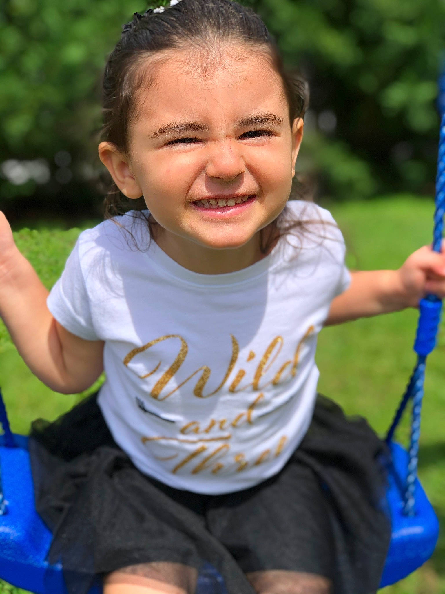 Asia is registered to the contest to win money with this photo: black, blue, eye, facial_expression, hair, hairstyle, hand, happy, head, joy, leaf, natural_environment, organ, people_in_nature, person, shorts, shoulder, skin, sleeve, smile