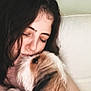 Stori Grace is registered to the contest to win money with this photo: woman, dog, pet, affection, close_up, indoor, cuddle, love, face, fur, long_hair, white_background, human, animal, friendship, portrait, cute, companion, tenderness, relaxation