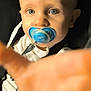 Léo participe au concours pour gagner de l'argent avec cette photo : toddler, child, pacifier, blue_eyes, blonde_hair, close_up, hand, baby, seatbelt, car_seat, white_clothing, curious, infant, indoor, portrait, cute, baby_accessory, straps, young_child, reaching_hand