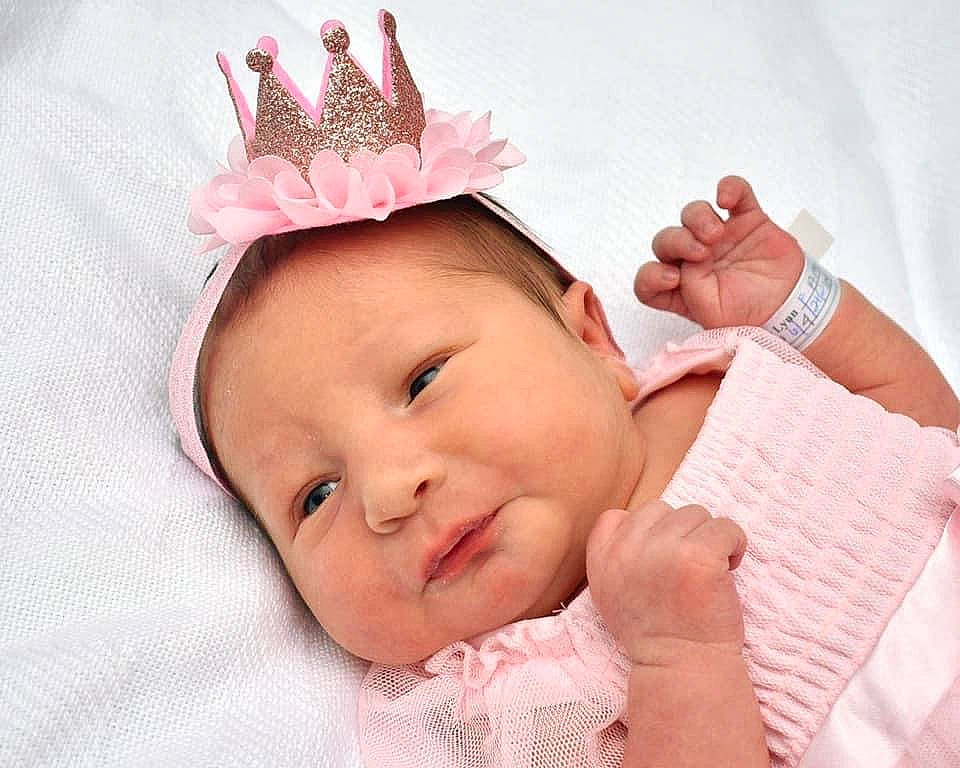 Holly is registered to the contest to win money with this photo: baby, baby_toddler_clothing, beauty, cheek, child, ear, eyelash, finger, gesture, hand, happy, headgear, lip, person, pink, product, skin, smile, textile, thumb