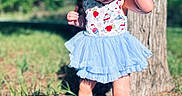 Scarlett joined the competition — help win amazing prizes! toddler, child, outdoor, tree, grass, barefoot, blue_tutu, headband, sunlight, shadow, curious, nature, summer, young_child, person, baby, cute, playful, standing, dress