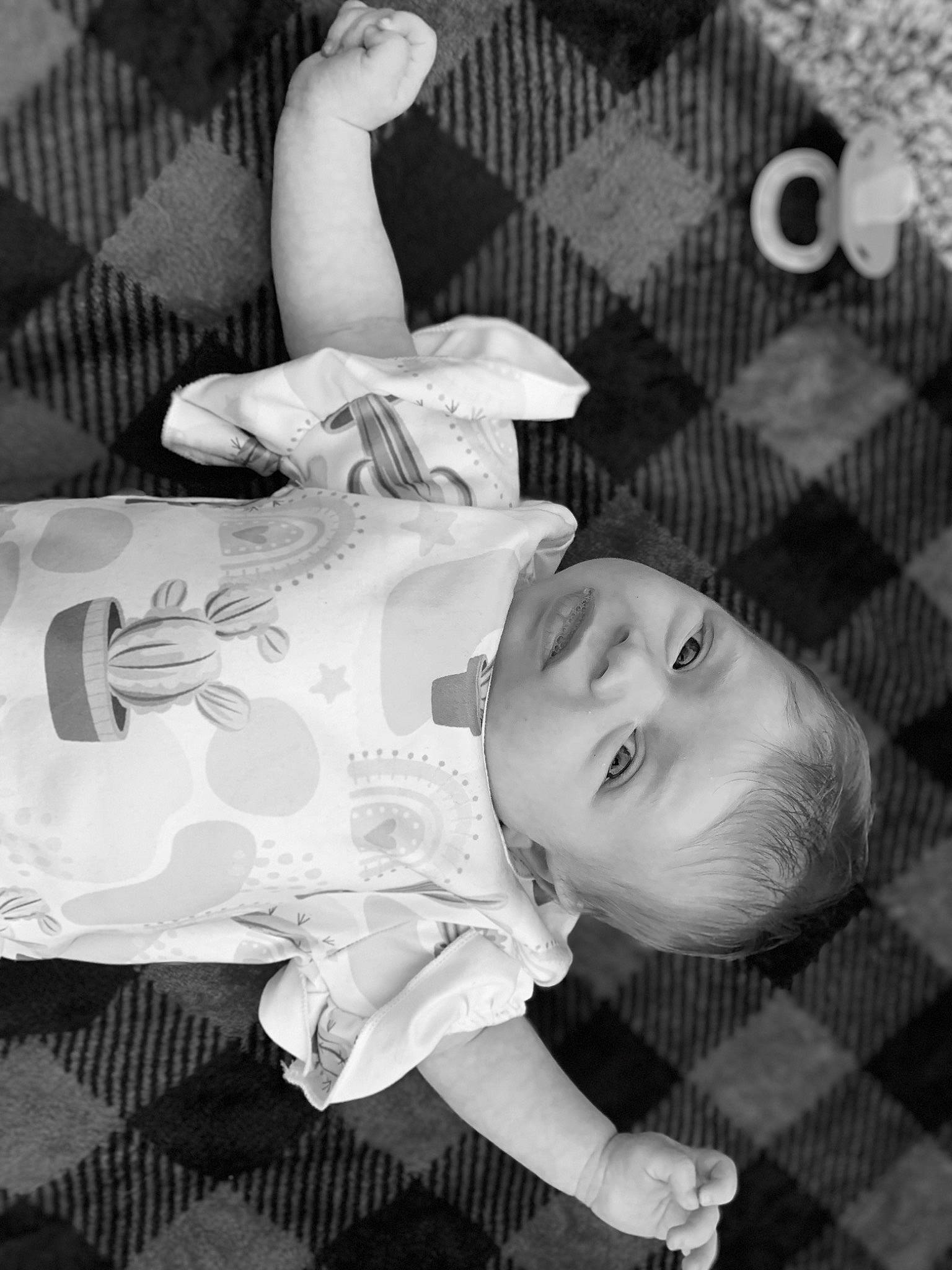Maryann is registered to the contest to win money with this photo: baby, baby_toddler_clothing, beauty, black, black_and_white, comfort, happy, head, line, mammal, monochrome, monochrome_photography, person, photograph, product, skin, smile, style, textile, toddler