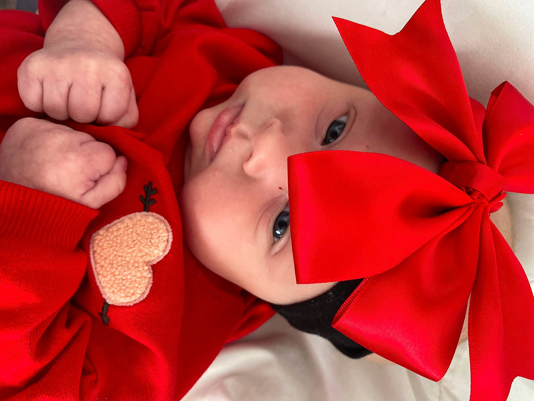 Mayklyn is registered to the contest to win money with this photo: baby_toddler_clothing, carmine, child, close_up, comfort, event, fashion_accessory, happy, headwear, holiday, lip, love, mouth, person, petal, pink, product, red, smile, textile