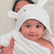 Krishiv is registered to the contest to win money with this photo: baby, child, towel, white, bunny_ears, cute, face, portrait, person, skin, hand, indoor, soft, closeup, expression, holding, infant, newborn, smiling, cozy