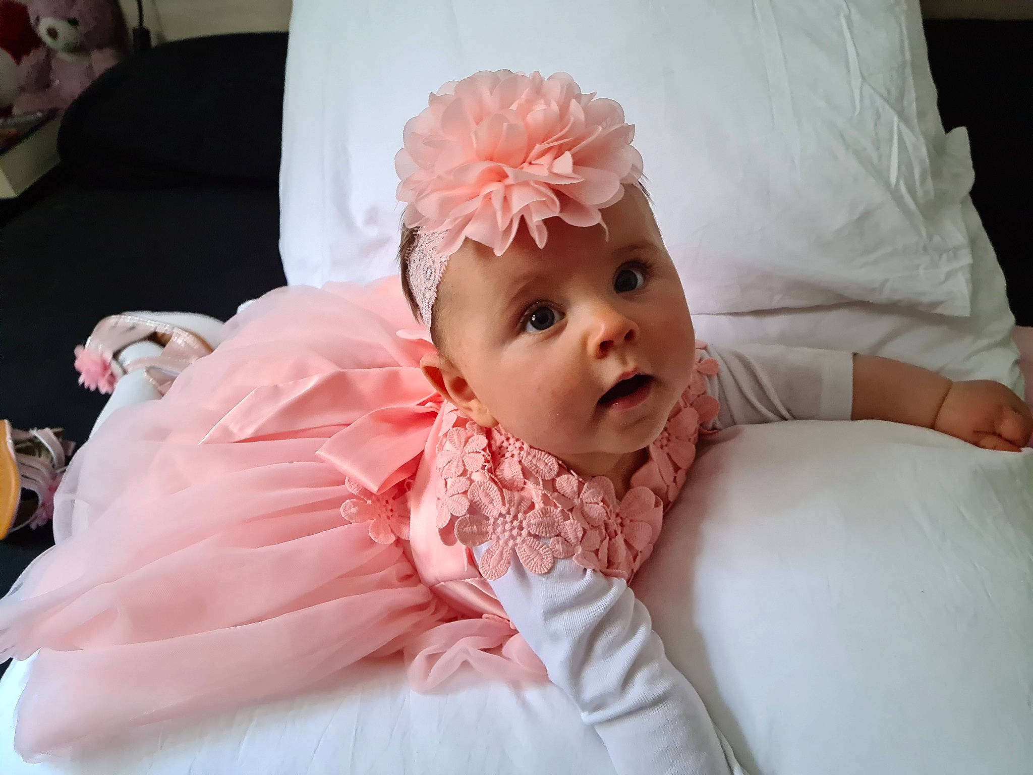Roxanne participe au concours pour gagner de l'argent avec cette photo : baby, baby_toddler_clothing, chin, comfort, event, eye, eyelash, flash_photography, happy, headband, headpiece, headwear, iris, linens, lip, peach, person, petal, pink, skin