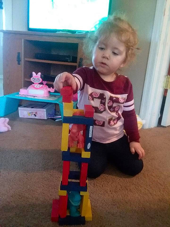 Blakelynn is registered to the contest to win money with this photo: baby_toys, child, kindergarten, person, play, standing, toddler, toy, toy_block