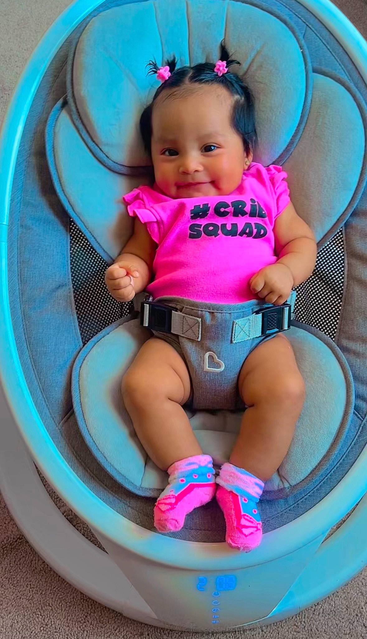 Hailey joined the competition — help win amazing prizes! baby, baby_carriage, baby_toddler_clothing, chair, child, circle, comfort, fun, head, human_leg, knee, leg, magenta, person, pink, shorts, skin, sneakers, thigh, toddler