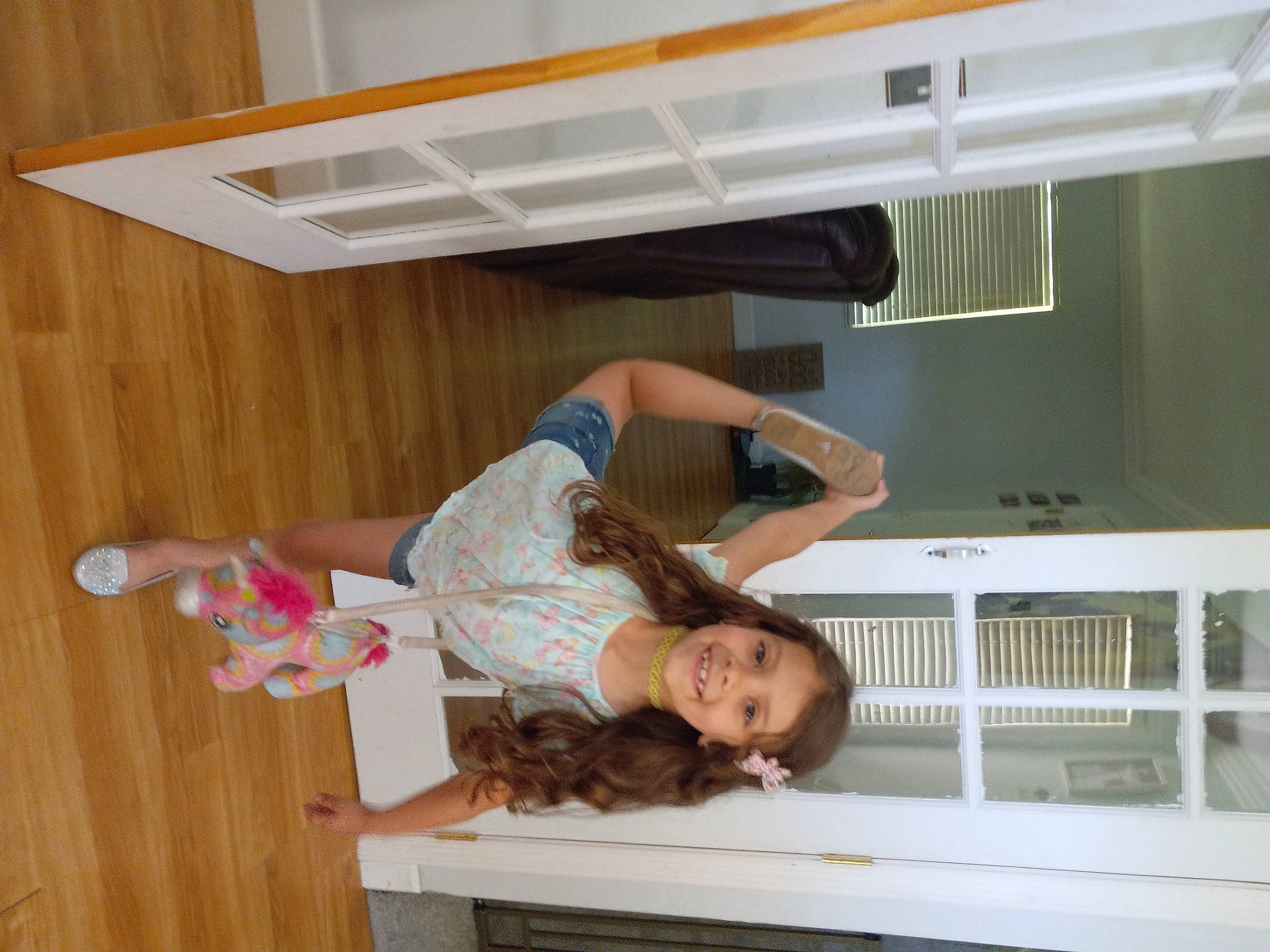 Jennica is registered to the contest to win money with this photo: ceiling, cleanliness, comfort, elbow, flooring, fun, hardwood, human_leg, joy, knee, person, room, smile, t_shirt, thigh, wood, wood_flooring, wood_stain, wrist