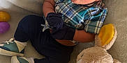 Kyrie is registered to the contest to win money with this photo: baby, bed, clothing, couch, cushion, face, footwear, furniture, glove, head, homedecor, medication, pants, person, photography, pill, plush, portrait, shoe, toy