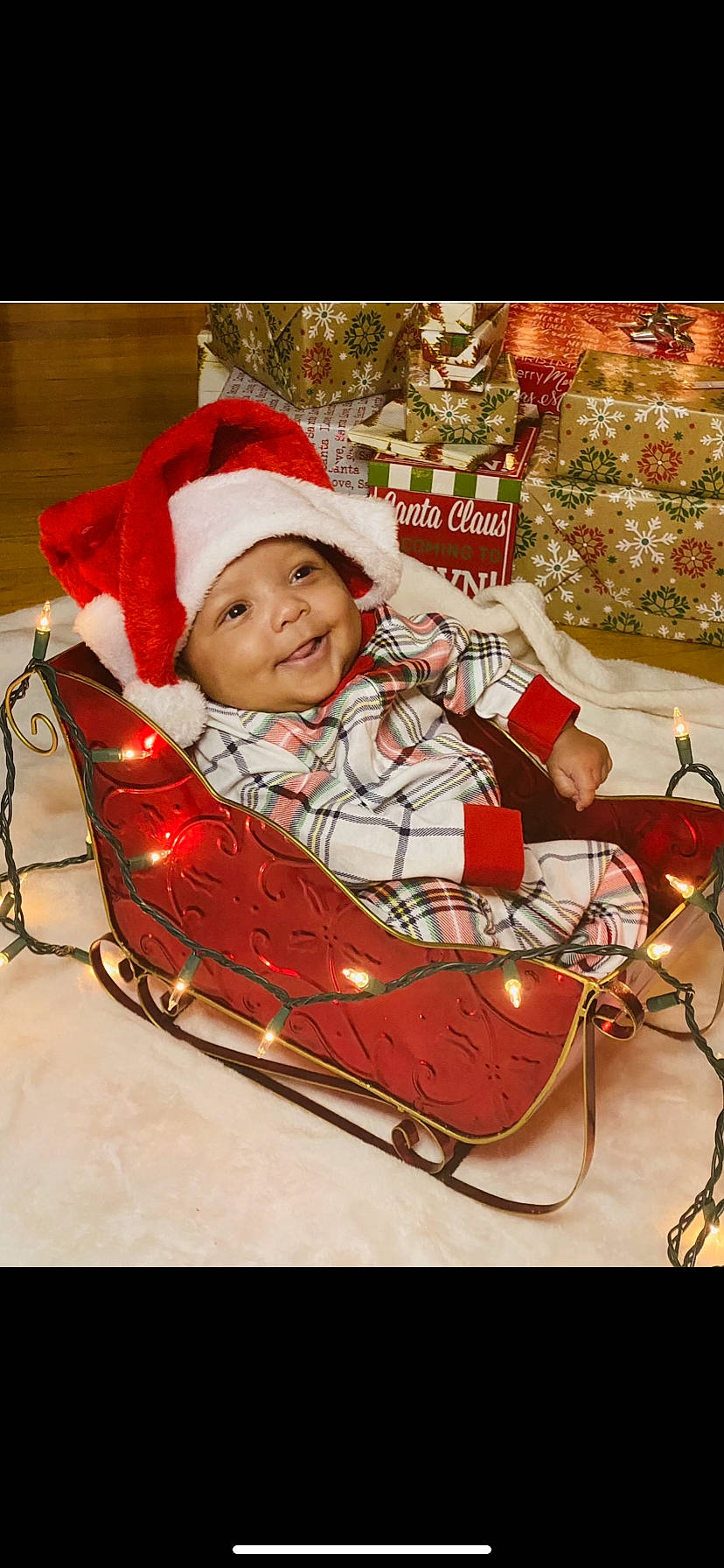 Caiden joined the competition — help win amazing prizes! baby, baby_carriage, baby_safety, baby_toddler_clothing, carmine, child, christmas, christmas_decoration, christmas_eve, comfort, event, fictional_character, fun, happy, headwear, holiday, joy, lap, person, sitting