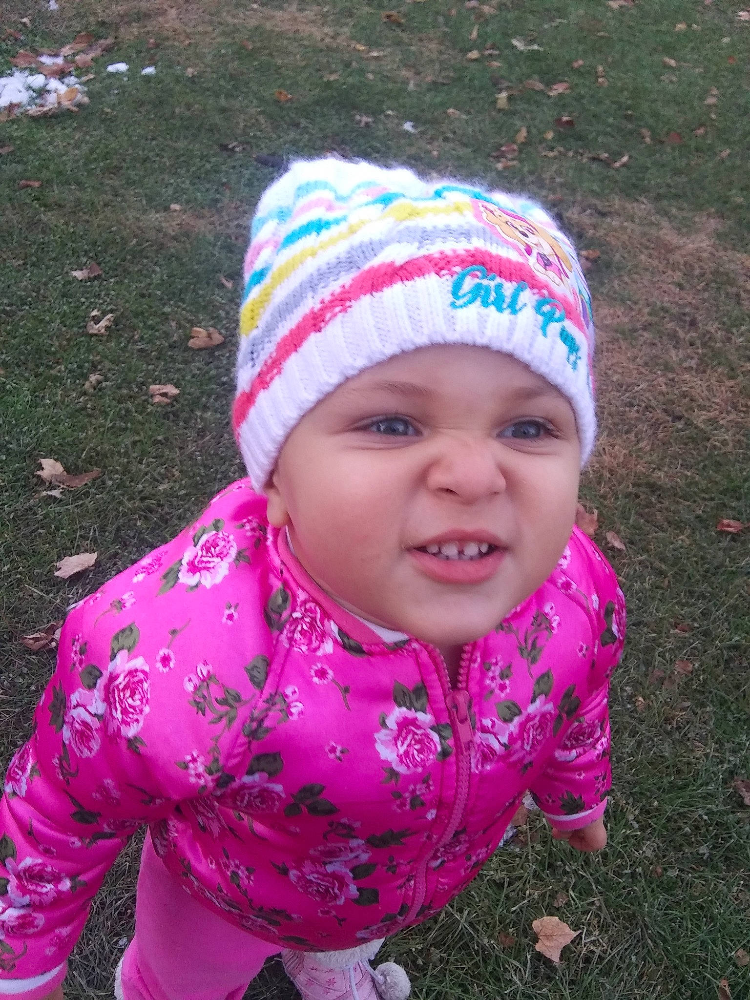 A'Raya joined the competition — help win amazing prizes! baby, beanie, bonnet, cap, child, grass, headgear, headwear, knit_cap, person, pink, smile, toddler, wool