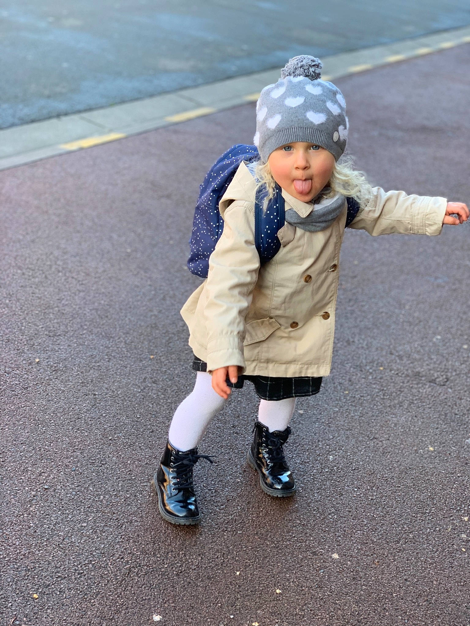 Pauline participe au concours pour gagner de l'argent avec cette photo : asphalt, child, footwear, fun, headwear, outerwear, person, play, recreation, shoe, toddler