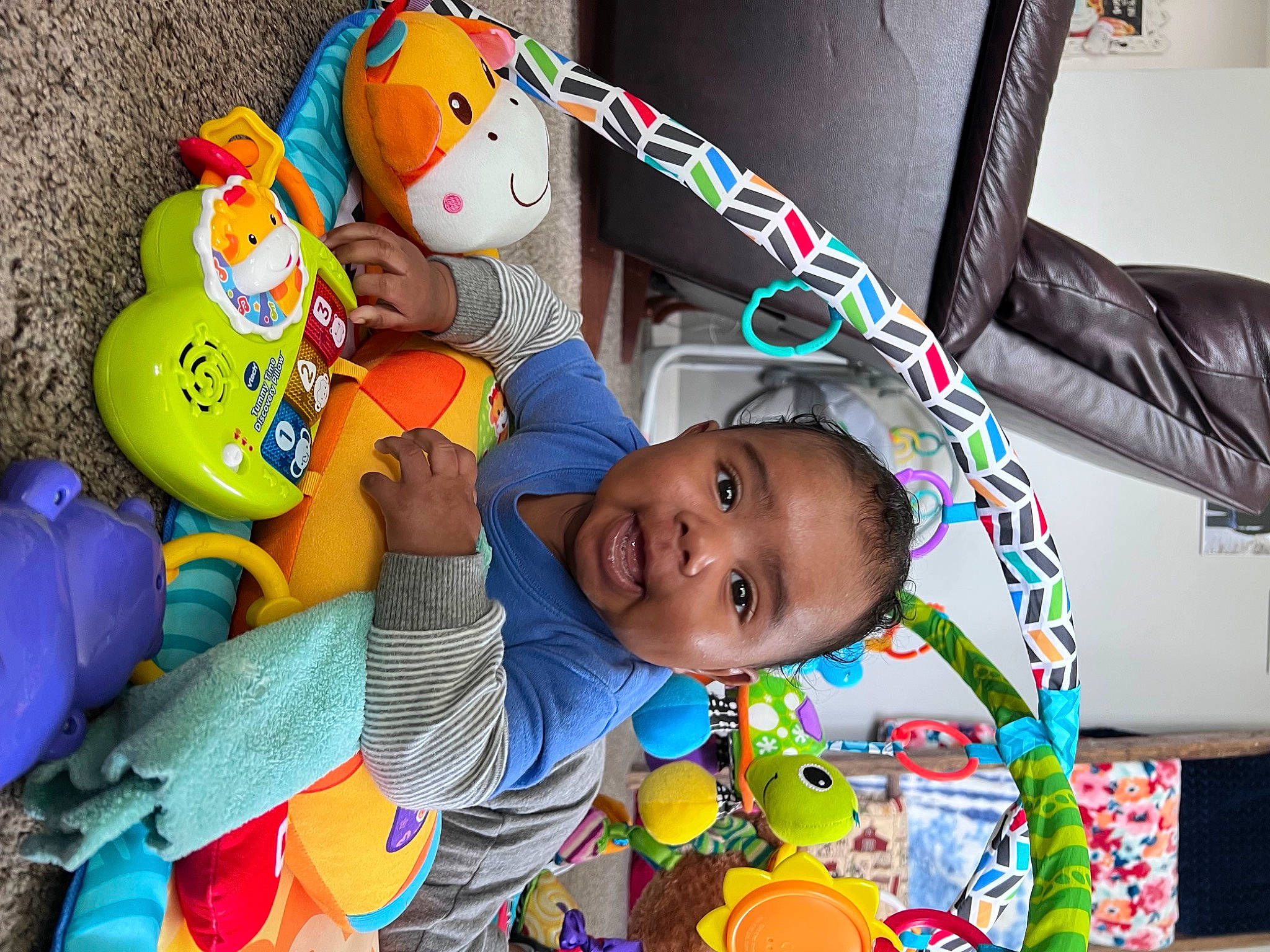 Luca is registered to the contest to win money with this photo: baby, baby_products, baby_toddler_clothing, baby_toys, child, event, facial_expression, fun, happy, leisure, person, play, plush, room, smile, stuffed_toy, t_shirt, textile, toddler, toy