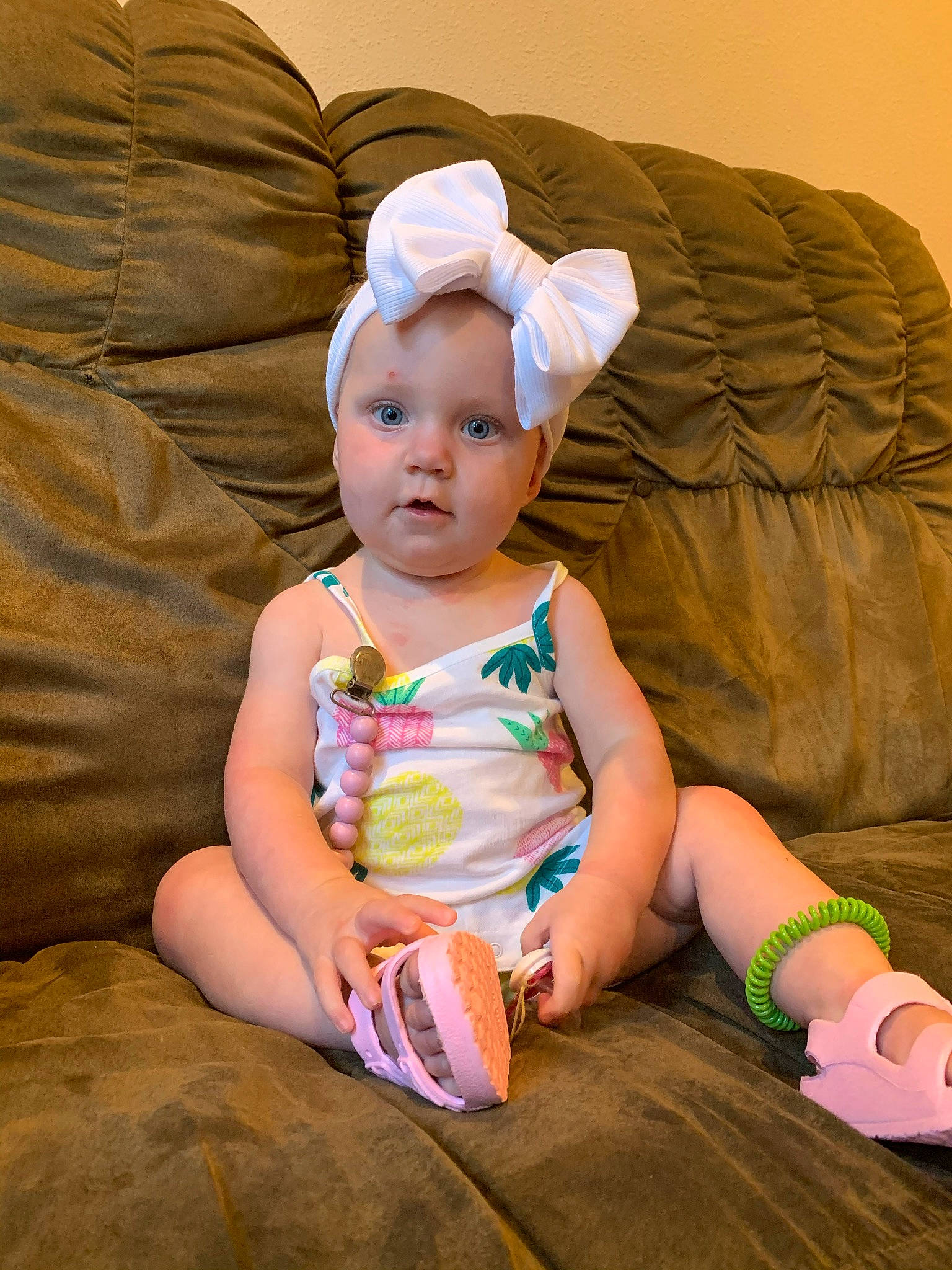 Marlie joined the competition — help win amazing prizes! baby, baby_toddler_clothing, child, comfort, face, facial_expression, finger, foot, fun, grass, happy, human_leg, pattern, person, sitting, skin, sleeve, sock, thigh, toddler
