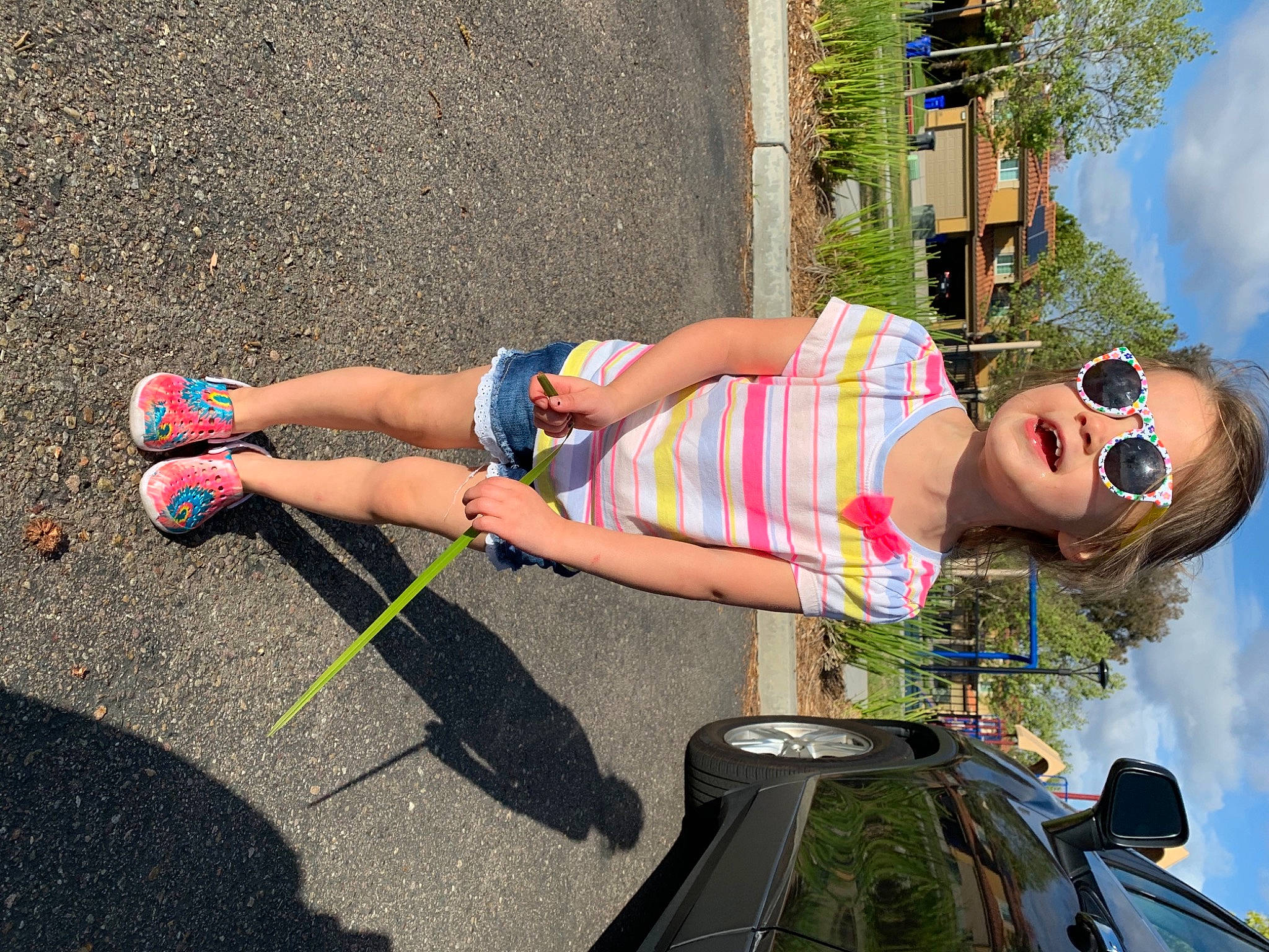 Madelynn joined the competition — help win amazing prizes! asphalt, electric_blue, eyewear, fun, goggles, grass, human_leg, knee, leg, leisure, motor_vehicle, person, plant, recreation, road_surface, sky, summer, sunglasses, thigh, travel