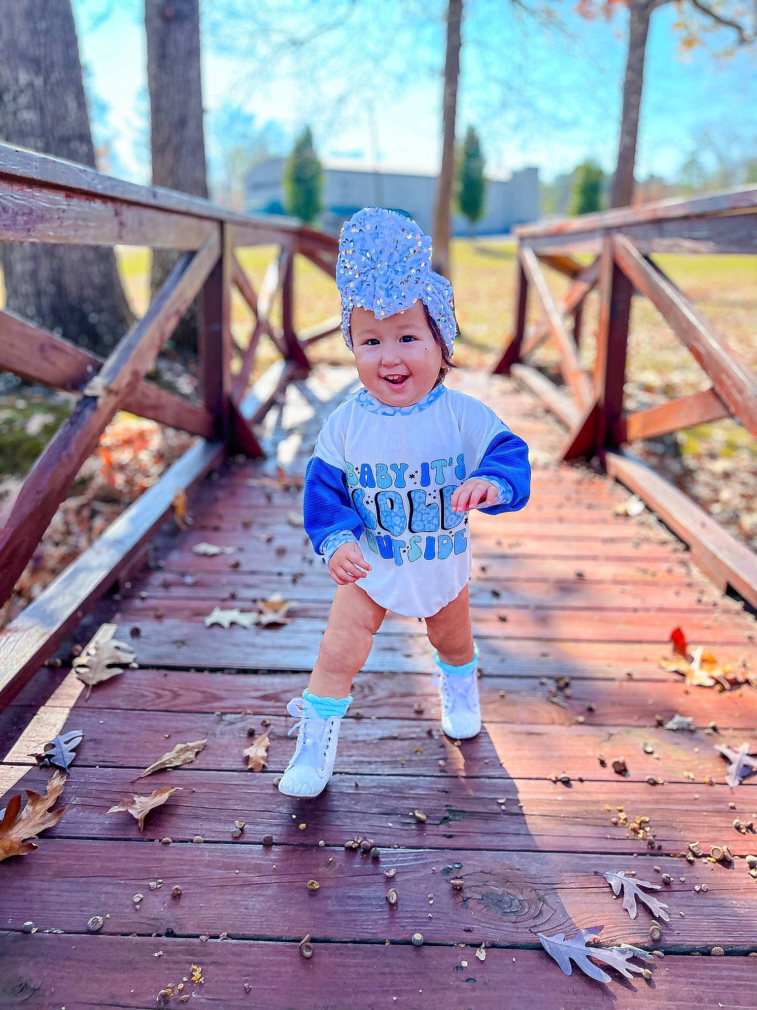 Luna is registered to the contest to win money with this photo: baby, boardwalk, bridge, cap, child, electric_blue, forest, fun, grass, happy, headwear, joy, leisure, people_in_nature, person, recreation, sky, sunlight, symmetry, t_shirt