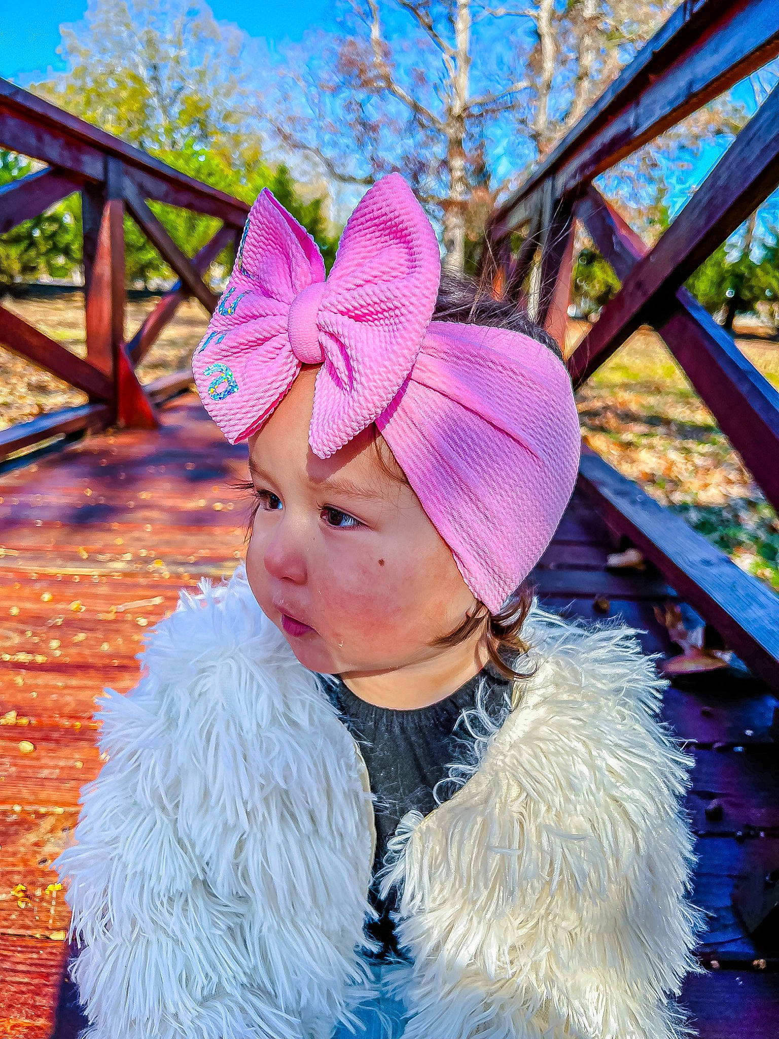 Luna is registered to the contest to win money with this photo: blue, cap, costume_hat, electric_blue, fashion_accessory, fun, fur, fur_clothing, grass, happy, headband, headgear, headpiece, headwear, leisure, magenta, people_in_nature, person, pink, plant