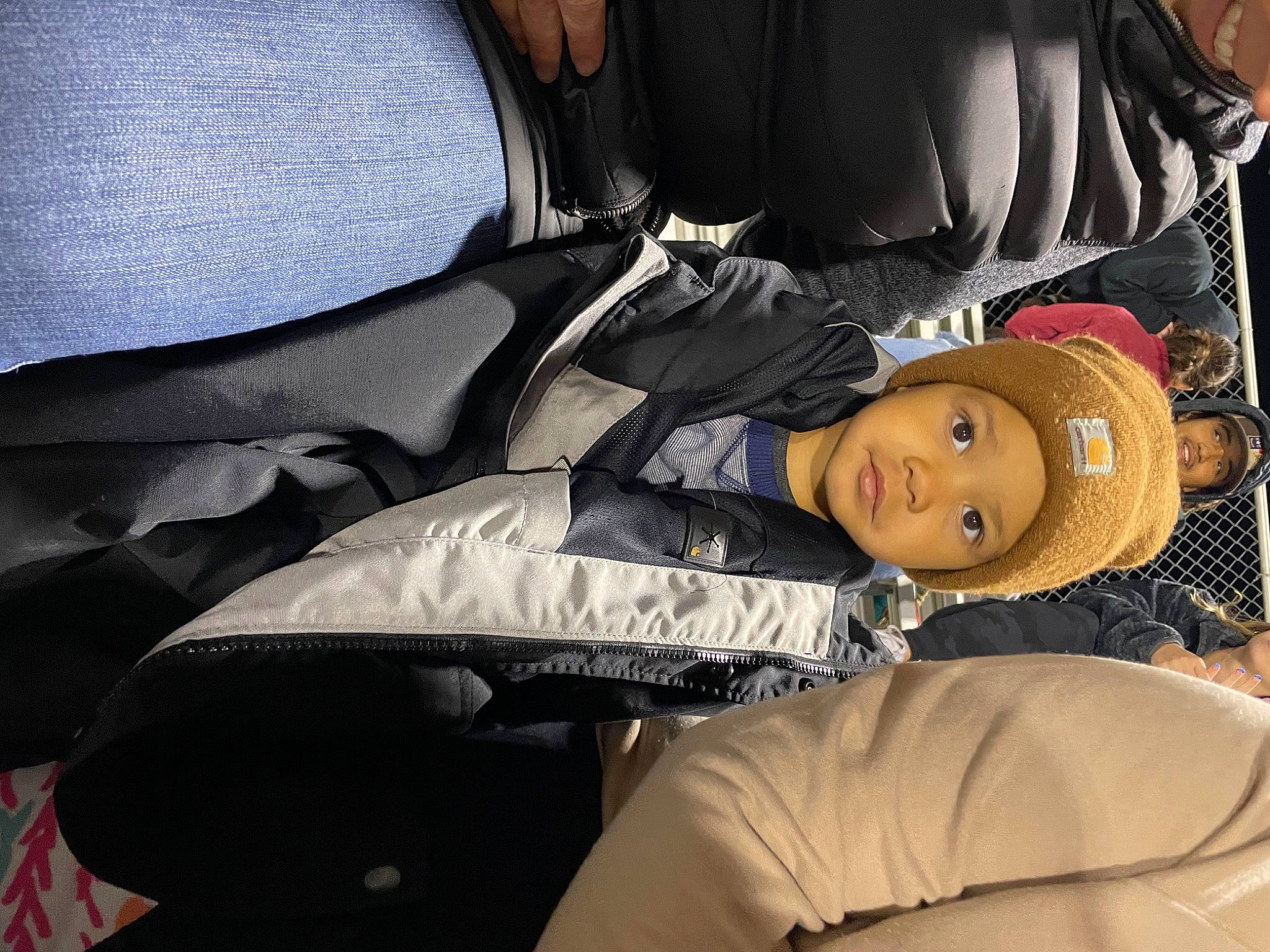 Carter is registered to the contest to win money with this photo: auto_part, automotive_design, car_seat, car_seat_cover, comfort, elbow, fashion_accessory, head_restraint, headgear, headwear, human_leg, linens, luxury_vehicle, motor_vehicle, passenger, person, sitting, smile, textile, thigh