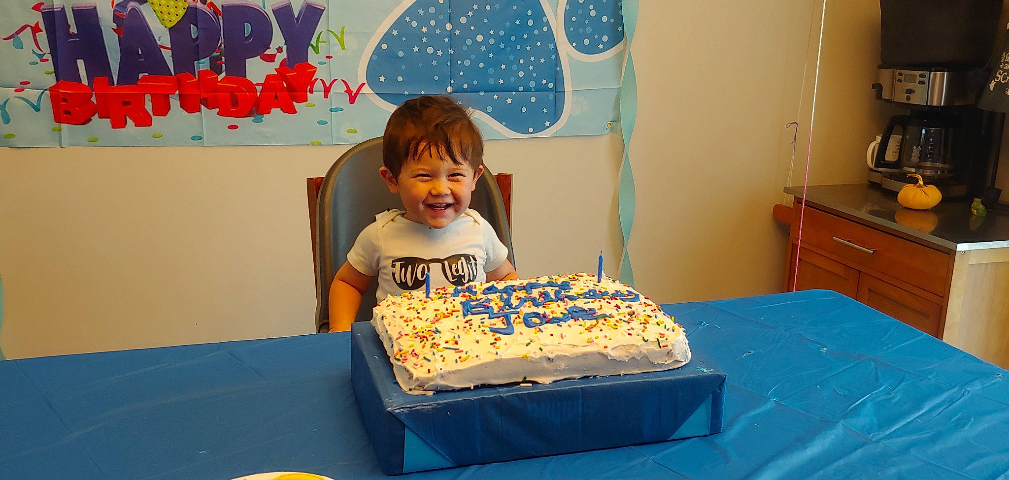 Jae is registered to the contest to win money with this photo: baked_goods, birthday, birthday_cake, blue, cabinetry, cake, cake_decorating, cake_decorating_supply, drawer, food, furniture, happy, ingredient, joy, person, plate, smile, sugar_cake, table, tableware