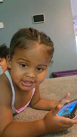 Key'Onnah joined the competition — help win amazing prizes! chair, chest, child, communication_device, desk, eyelash, fun, gadget, hand, happy, leisure, mobile_device, mobile_phone, person, portable_communications_device, room, smile, summer, tablet_computer, thumb