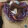 baby, bed, blanket, box, brown_skin, child, diaper, foot, hand, healthcare, indoor, medical_device, paint, paper, purple, relaxing, resting, sleeping, striped_sheet, toy