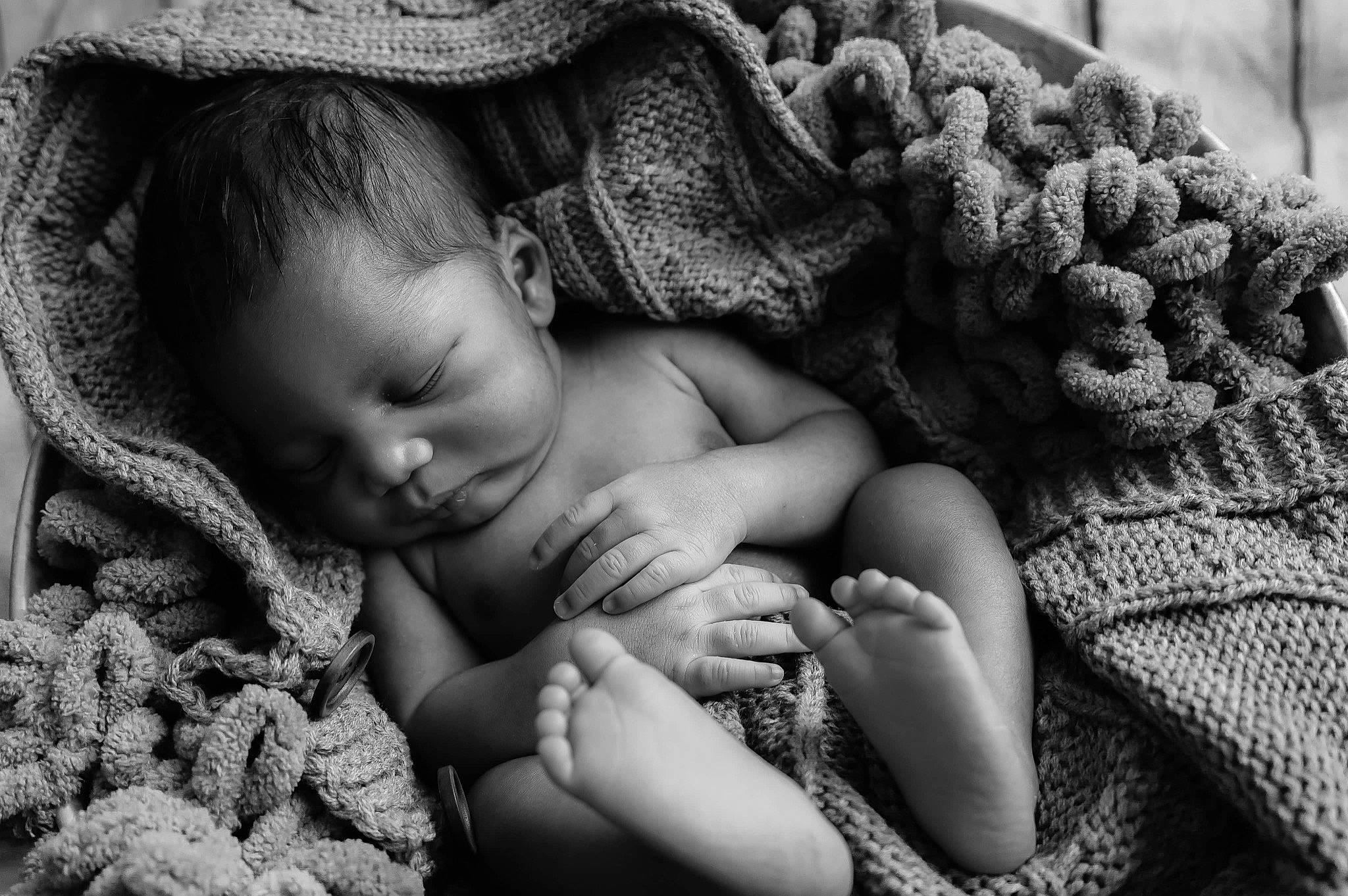 Amani is registered to the contest to win money with this photo: baby, black, black_and_white, comfort, eye, face, finger, gesture, hairstyle, hand, happy, head, human_body, iris, leaf, mammal, people_in_nature, person, skin, smile