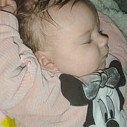 Elyria is registered to the contest to win money with this photo: baby, infant, sleeping, pink_clothing, minnie_mouse, cartoon, blanket, sherpa, closeup, face, cheek, ear, hair, eyelashes, cozy, indoor, flash, soft_texture, pajamas, cute