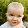 baby, child, face, blue_eyes, smile, portrait, close_up, innocence, curiosity, blond_hair, outdoor, nature, soft_light, young_child, cute, infant, person, head, expression, background_blur