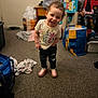 Rain joined the competition — help win amazing prizes! toddler, child, smiling, indoor, carpet, clothing, shirt, shoes, curly_hair, toy, furniture, bag, laundry, cabinet, floor, person, happy, casual, young_child, home