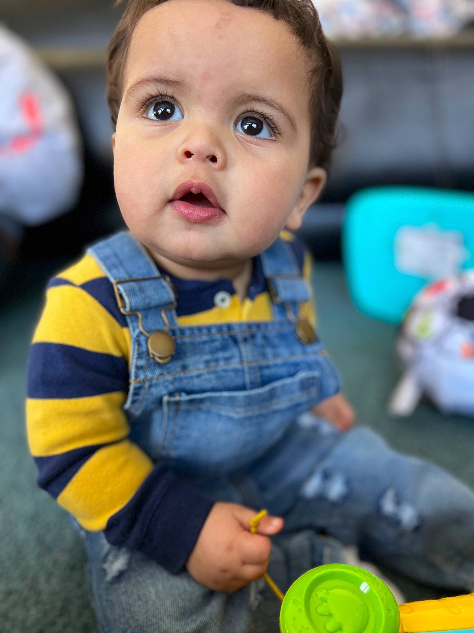 Zakariye is registered to the contest to win money with this photo: baby, baby_products, baby_toddler_clothing, baby_toys, cheek, child, eye, face, fun, hair, happy, human_body, nose, person, play, sitting, skin, sleeve, surprise, toddler