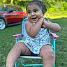 toddler, child, smiling, outdoor, grass, chair, summer_clothing, happy, person, portrait, daylight, nature, car, greenery, cute, sitting, playful, sunlight, baby, casual