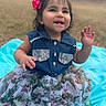 Massiel is registered to the contest to win money with this photo: toddler, child, smiling, outdoor, grass, denim, dress, bow, happy, sitting, blanket, cute, portrait, young_child, fashion, playful, person, fun, nature, baby