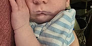 Jesse joined the competition — help win amazing prizes! baby, sleeping, infant, hand, striped_clothing, blanket, arm, person, closeup, face, peaceful, resting, comfort, cuddle, young_child, indoor, parent, holding, skin, casual_clothing