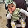Kevrianys Sophia joined the competition — help win amazing prizes! baby, child, stroller, headband, flower, green_clothing, floral_leggings, sitting, indoors, cute, person, infant, foot, hand, portrait, fashion, pensive, expression, comfort, seat