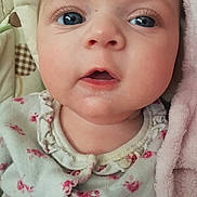 Halley-Ann joined the competition — help win amazing prizes! baby, close_up, face, blue_eyes, infant, child, pink_blanket, floral_clothing, soft_texture, cute, portrait, skin, young, expression, indoors, sleepwear, newborn, mouth_open, eyelashes, head