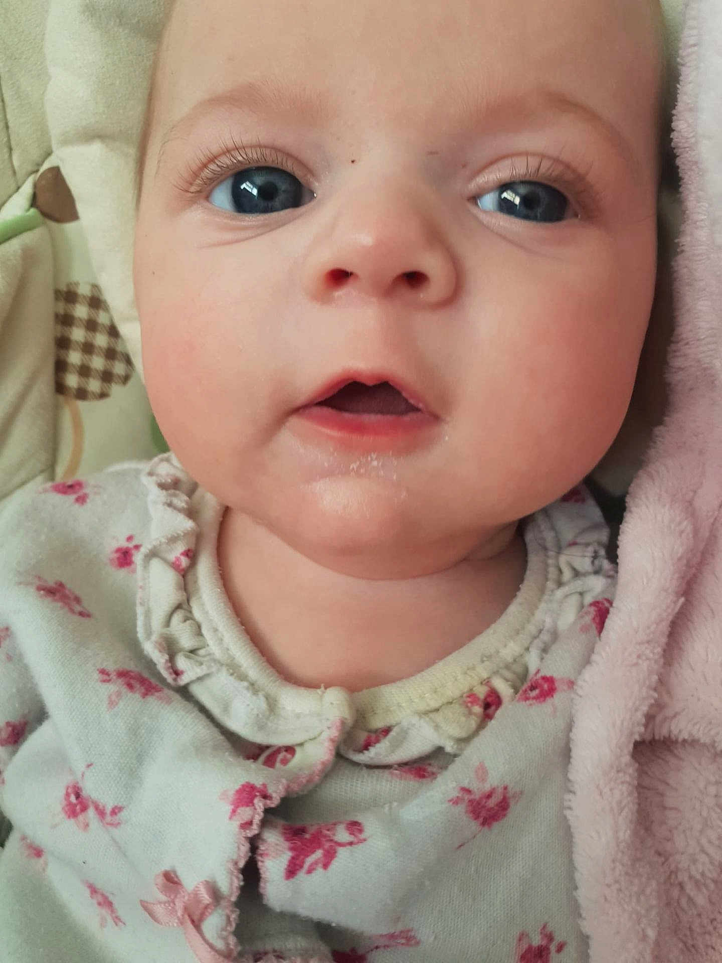 Halley-Ann joined the competition — help win amazing prizes! baby, close_up, face, blue_eyes, infant, child, pink_blanket, floral_clothing, soft_texture, cute, portrait, skin, young, expression, indoors, sleepwear, newborn, mouth_open, eyelashes, head