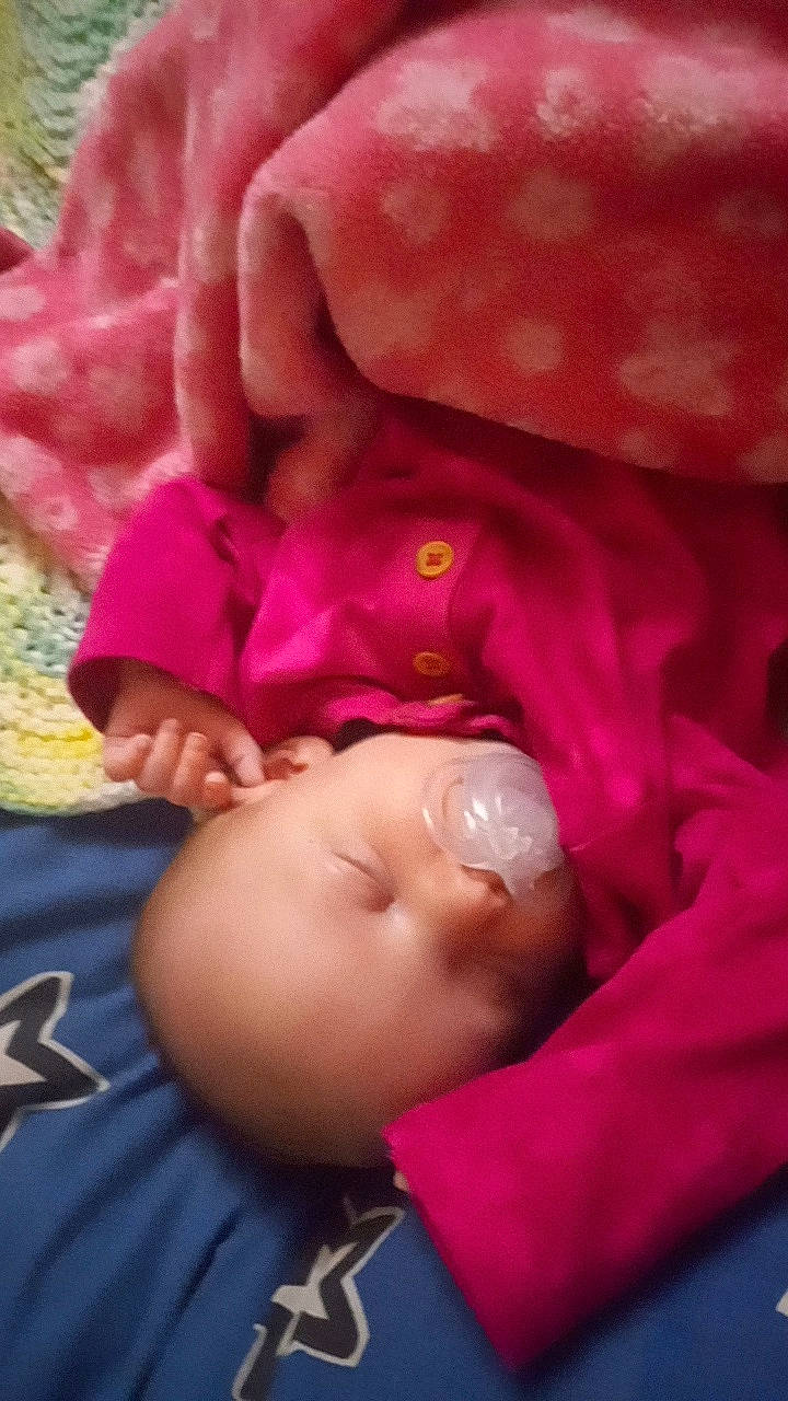 Bailey joined the competition — help win amazing prizes! baby, baby_products, cheek, child, comfort, finger, gesture, happy, linens, magenta, mouth, nail, nose, person, petal, pink, purple, rose, skin, textile