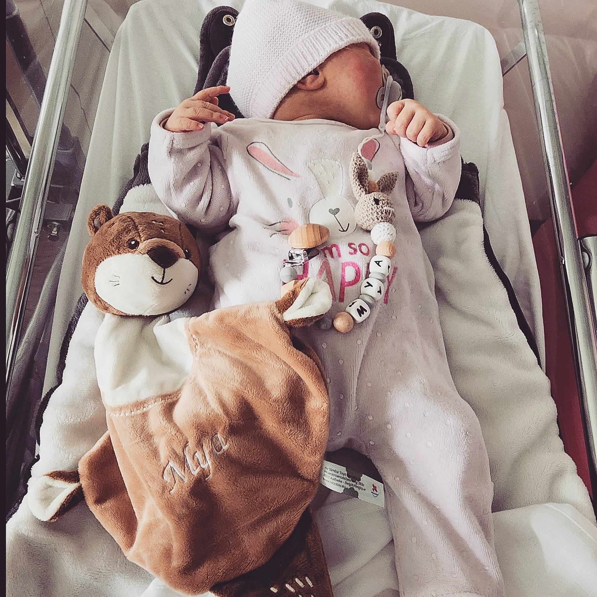 Mya participe au concours pour gagner de l'argent avec cette photo : baby, baby_safety, baby_sleeping, baby_toddler_clothing, child, comfort, cool, hand, headgear, infant_bed, linens, mammal, person, pink, product, skin, sleeve, stuffed_toy, textile, toddler