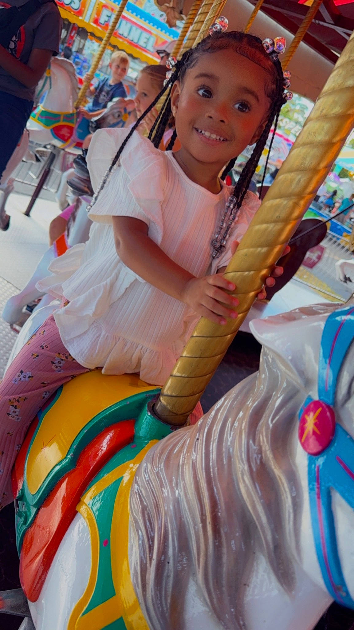 Reign is registered to the contest to win money with this photo: amusement_park, amusement_ride, carousel, child, event, fashion_design, festival, fun, happy, jewellery, joy, leisure, necklace, nonbuilding_structure, person, recreation, smile, thigh, toddler, tradition