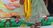 Na'Ryhia Smith joined the competition — help win amazing prizes! toddler, child, balloon, birthday, dress, table, footwear, cartoon, princess, celebration, party, green_dress, outdoor, portrait, person, smiling, cute, young_child, event, colorful