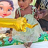 Na'Ryhia Smith joined the competition — help win amazing prizes! toddler, child, girl, balloon, golden_balloon, birthday, party, dress, sandals, hand_holding, adult, cartoon_backdrop, celebration, outdoor, smiling, curly_hair, happy, event, colorful, festive