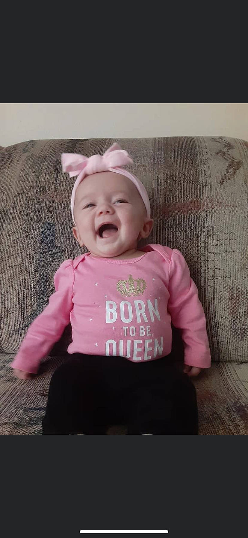 Aspyn joined the competition — help win amazing prizes! baby, baby_toddler_clothing, cap, cheek, child, clothing, comfort, face, font, happy, headwear, magenta, outerwear, pattern, person, pink, sitting, skin, sleeve, smile