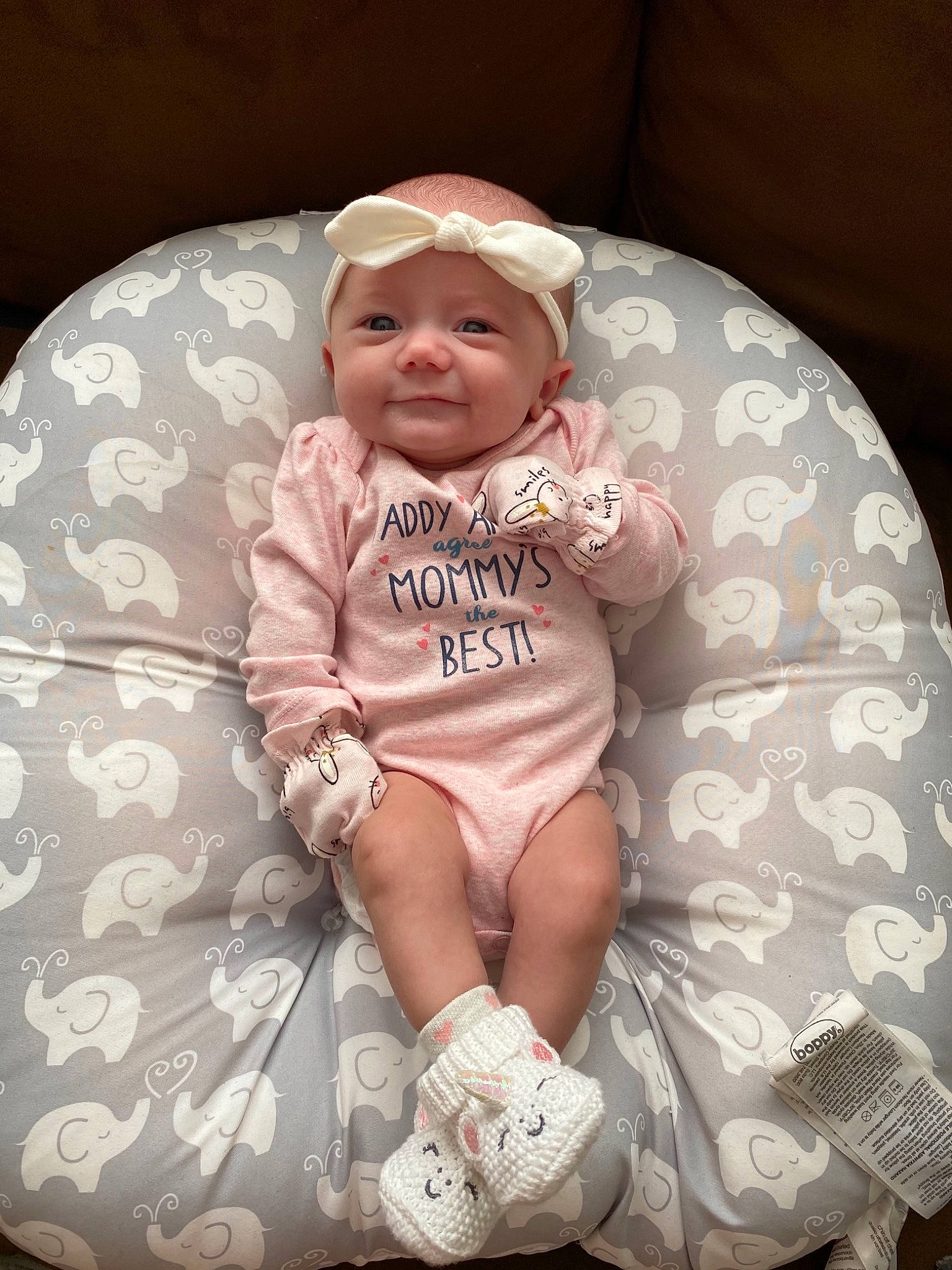 Aspyn joined the competition — help win amazing prizes! baby, baby_carriage, baby_products, baby_toddler_clothing, cap, child, comfort, fashion_accessory, headwear, human_leg, knee, lap, linens, pattern, person, pink, sitting, sleeve, smile, sock
