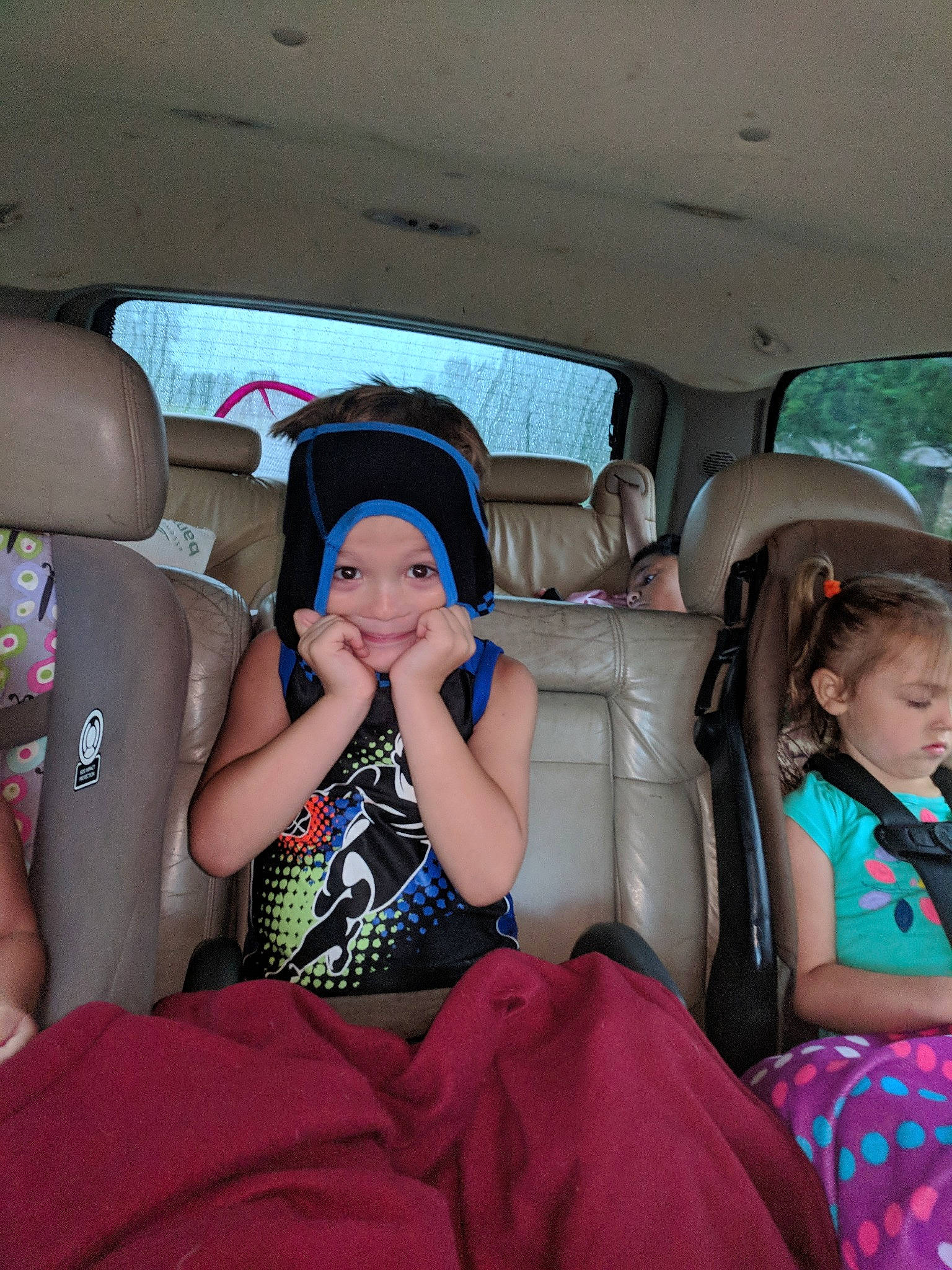 Wyatt is registered to the contest to win money with this photo: auto_part, car, car_seat, child, family_car, finger, fun, head_restraint, joy, leisure, luxury_vehicle, passenger, person, sitting, vacation, vehicle