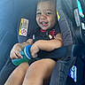 August is registered to the contest to win money with this photo: baby, car, car_seat, child, clothing, cute, happy, infant, interior, joy, person, portrait, safety, seat, seatbelt, sippy_cup, sitting, smile, toddler, young_child
