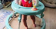 Emiely joined the competition — help win amazing prizes! baby, walker, indoor, child, red_clothing, floor, wooden_floor, toy, happy, smiling, heart_graphics, curtains, dog_bed, dog, chair, person, feet, playful, cute, infant